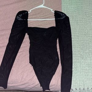 black square-neck body suit with sheer sleeves